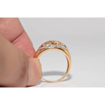 Luxury lab created gemstone ring with emerald cut green stone and diamond accents