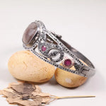 Vintage Art Deco sterling silver cuff bracelet with ruby accents, filigree diamond design, unique antique anniversary jewelry
