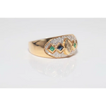 Luxury lab created gemstone ring with emerald cut green stone and diamond accents