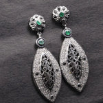 Victorian style silver filigree dangle earrings with emerald and black diamond accents, handmade statement jewelry gift.