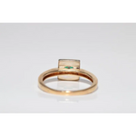 Stylish lab created gemstone ring with ruby red center stone and white diamond halo