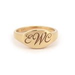Personalized gold alphabet ring for women featuring dainty initial design in a modern signet style