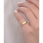 Elegant personalized gold initial ring with dainty alphabet and classic signet ring style