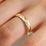 featuring a diamond sunburst. A perfect minimal jewelry piece for effortless elegance.