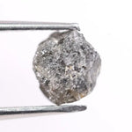 Natural black diamond ring featuring a faceted stone in a rose gold