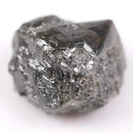 Natural black diamond ring featuring a faceted stone in a rose gold