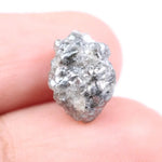 Salt and pepper diamond ring showcasing raw gray diamond texture and unique inclusions