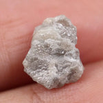 Natural gray diamond ring featuring salt and pepper inclusions and minimalist design