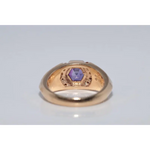 Modern lab created gemstone ring with aquamarine center and brilliant white diamonds