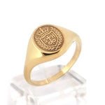 Minimalist gold initial signet ring for women with personalized alphabet detail and dainty finish