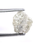 Custom white diamond ring with emerald cut stone set in a handcrafted bridal design.