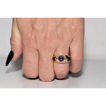 Modern lab created gemstone ring with aquamarine center and brilliant white diamonds