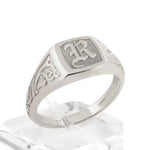 Elegant dainty gold initial ring with custom alphabet engraving in a sleek and stylish signet design
