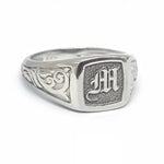 Elegant dainty gold initial ring with custom alphabet engraving in a sleek and stylish signet design