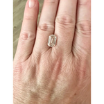 Explore a 4.10 Ct light brown lab grown diamond with a classic emerald cut. A refined step-cut stone perfect for custom engagement rings and luxury jewelry.