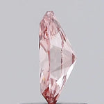 vivid pink colour diamond lab grown diamond with brilliant facets on a light gray background.