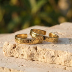 Silver couple rings with engraved date, personalized memory of love.