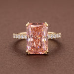Radiant cut peach pink diamond ring with 14K gold pave band