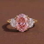 3 stone oval engagement ring with elegant diamond setting