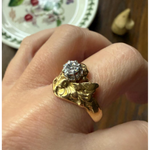 Elongated round cut engagement ring in yellow gold