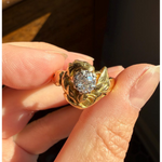 Elongated round cut engagement ring in yellow gold
