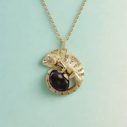 religious gold pendant with sapphire pendant gemstone accents and vintage pendant necklace craftsmanship.