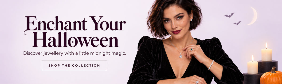Woman wearing a pendant necklace, stud earrings, tennis bracelet and rings in a Halloween jewelry collection banner with candles and a pumpkin.