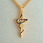 Gold horseshoe necklace with lucky charm pendant luxury style