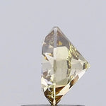 light brownish yellow colour diamond round brilliant light brownish yellow lab diamond light grey background