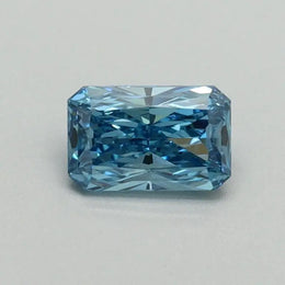 Gentle Brilliance 0.50 Ct Fancy Vivid Blue Radiant Cut Lab Grown Diamond showcasing vibrant color and sharp faceting. Ethically created with stunning clarity, this luxury statement stone offers modern elegance and rare, eye-catching beauty.
