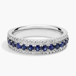 lab-created ruby-pink oval cut gemstone ring, adorned with sparkling white accent stones