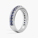 lab-created ruby-pink oval cut gemstone ring, adorned with sparkling white accent stones
