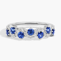 2.74 carat lab created blue sapphire engagement ring with accent diamonds in a luxury elegant design