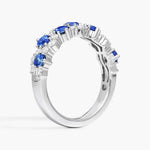 2.74 carat lab created blue sapphire engagement ring with accent diamonds in a luxury elegant design