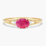 Designer gemstone ring featuring colorful stone with modern band for stylish appearance