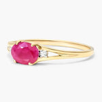 Designer gemstone ring featuring colorful stone with modern band for stylish appearance