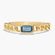 Classic gemstone ring with vibrant stone and delicate band design for timeless elegance