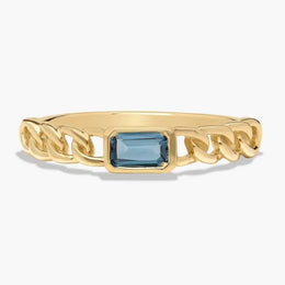 Classic gemstone ring with vibrant stone and delicate band design for timeless elegance