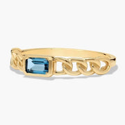 Classic gemstone ring with vibrant stone and delicate band design for timeless elegance
