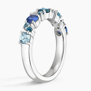 Trendy gemstone ring with baguette cut stones and modern geometric band design