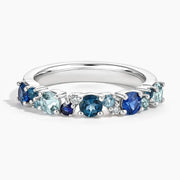 Trendy gemstone ring with baguette cut stones and modern geometric band design
