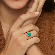Glamorous gemstone ring with radiant cut stone and halo setting for luxury jewelry look