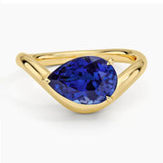 Elegant gemstone ring with blue color stone and shining white stones for luxury style