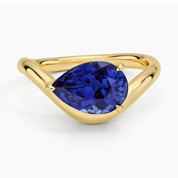 Elegant gemstone ring with blue color stone and shining white stones for luxury style