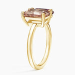 Premium gemstone ring with round cut center stone and brilliant pave set diamonds