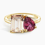 Premium gemstone ring with round cut center stone and brilliant pave set diamonds
