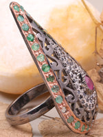 Decorative ring with gemstones on a leafy background