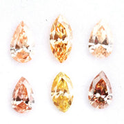 Fancy champagne and yellow pear & marquise cut lab grown diamonds, brilliant faceted loose stones for luxury jewelry design.