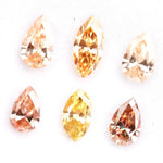 Fancy champagne and yellow pear & marquise cut lab grown diamonds, brilliant faceted loose stones for luxury jewelry design.