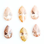 Fancy champagne and yellow pear & marquise cut lab grown diamonds, brilliant faceted loose stones for luxury jewelry design.